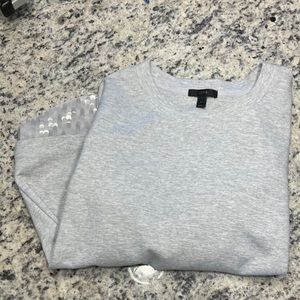 Jcrew grey sweater with layered detail at the bottom